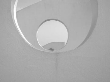 Captivating abstract view of a spiral staircase in black and white.