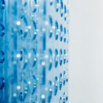 Close-up of an abstract blue surface featuring circular indentations creating a modern pattern.