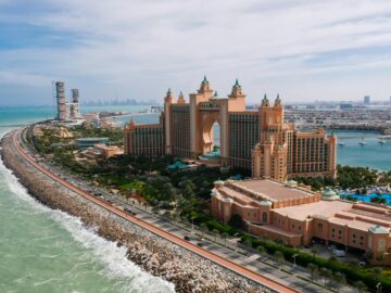 A breathtaking drone shot of Atlantis, The Palm resort in Dubai, highlighting the luxurious urban landscape.