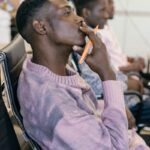 Business professional in a thoughtful pose during a meeting.