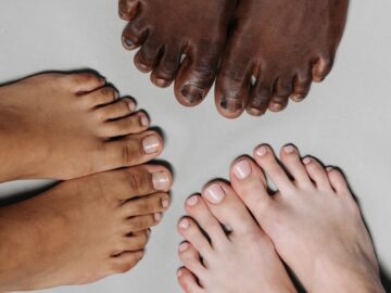 A top view of multiple feet showcasing diversity and unity among individuals.