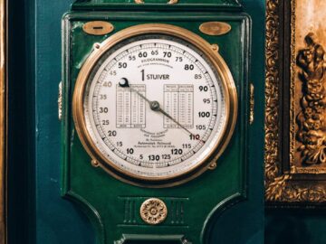 Classic barometer with ornate design, perfect for vintage decor enthusiasts.