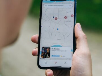 person holding white android smartphone