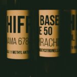 a close up of three bottles of wine