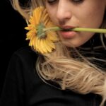 woman in black shirt with yellow hair