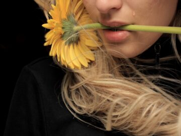 woman in black shirt with yellow hair