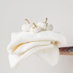 a white towel with a white bow