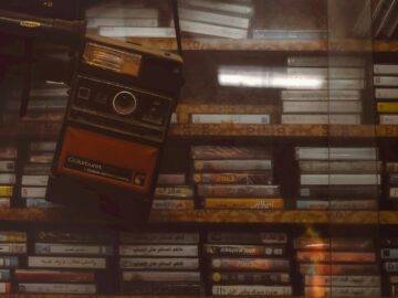 a cell phone hanging from a shelf in a store